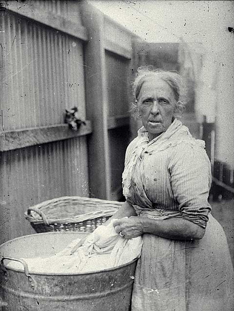 Washing clothes in an iron tub, c1890s